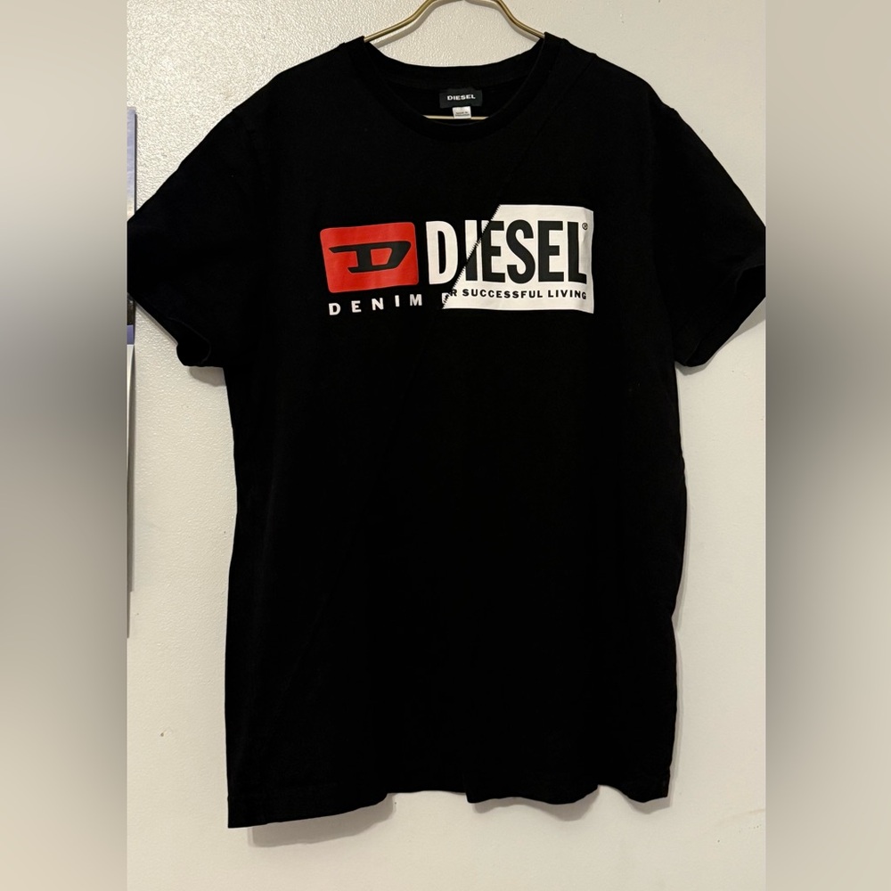 Diesel Black Tee with Red and White Logo It has two small holes behind the neck